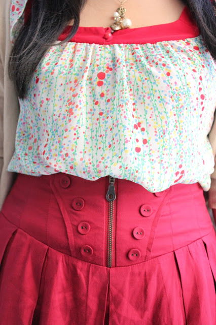 Print Top Tucked Into High Waist Skirt